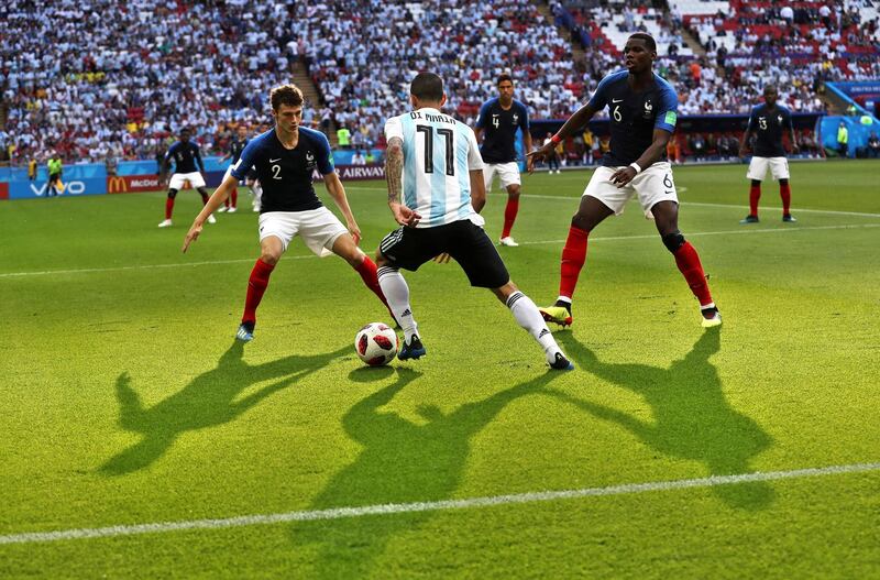 epaselect epa06852158 Angel Di Maria (C) of Argentina in action against Paul Pogba (R) and Benjamin Pavard (L) of France during the FIFA World Cup 2018 round of 16 soccer match between France and Argentina in Kazan, Russia, 30 June 2018.

(RESTRICTIONS APPLY: Editorial Use Only, not used in association with any commercial entity - Images must not be used in any form of alert service or push service of any kind including via mobile alert services, downloads to mobile devices or MMS messaging - Images must appear as still images and must not emulate match action video footage - No alteration is made to, and no text or image is superimposed over, any published image which: (a) intentionally obscures or removes a sponsor identification image; or (b) adds or overlays the commercial identification of any third party which is not officially associated with the FIFA World Cup)  EPA/MAHMOUD KHALED   EDITORIAL USE ONLY