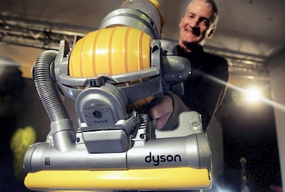 LONDON - MARCH 14: Inventor James Dyson demonstrates his latest hoovering invention on March 14, 2005 in London. The vaccum cleaner replaces the traditional four wheels with one ball to guide it across the floor giving it increased maneouverability. (Photo by Bruno Vincent/Getty Images)