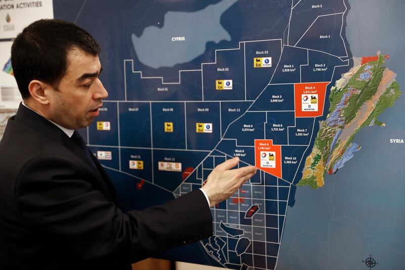 Lebanon's Energy Minister Cesar Abi Khalil, explains on the map about the offshore block 9 which Israel claims, during an interview with the Associated Press at his office, in Beirut, Lebanon, Thursday, Feb. 1, 2018. Abi Khalil has vowed the country will go ahead in its oil and gas exploration tender near its maritime border with Israel despite Israeli claims the field belongs to it. (AP Photo/Hussein Malla)