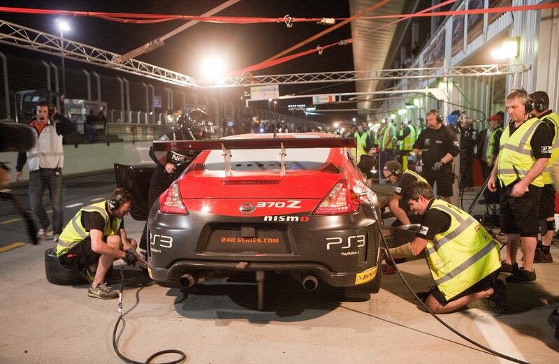 Dubai, United Arab Emirates, Jan 11 2013, 24h Dunlop , Night Pit Crews - Pit crews scramble to make good time early in the race of the 2013 24h Dunlop series. Mike Young / The National  