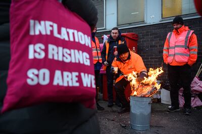 Striking postal workers outside a Royal Mail sorting office in London. Getty Images