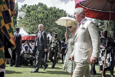 Britain's Prince Charles, Prince of Wales (R) and his wife Britain's Camilla, Duchess of Cornwall (C) visit Osei Tutu II, the Asantahene or king of Ghana's Asante people, at Manhyia palace in Kumasi, Ghana on November 4, 2018. - Taking tea with Osei Tutu II, the Asantahene or king of Ghana's Asante people, and a reception with paramount rulers is all in a day's work for the Prince of Wales. (Photo by Ruth McDowall / AFP)