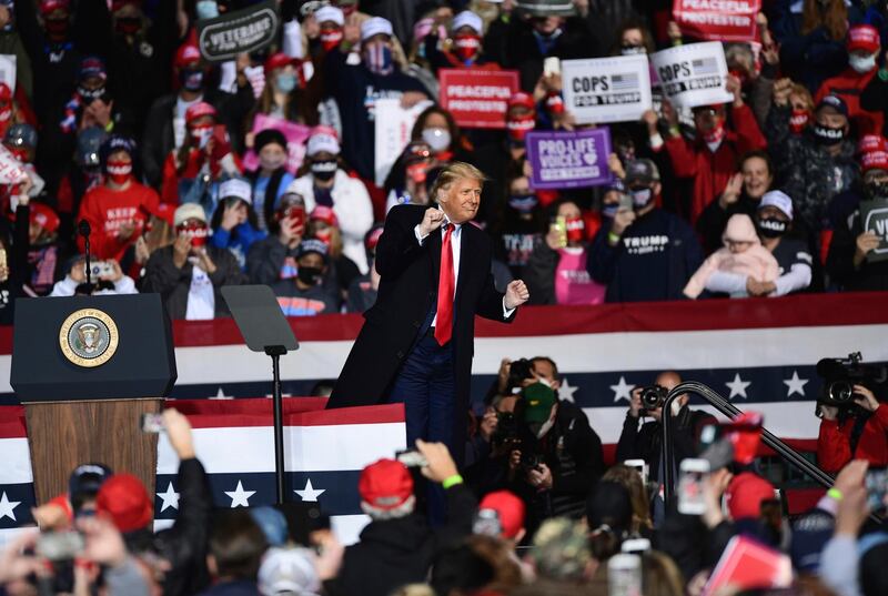 President Donald Trump dances to music during a campaign rally at the John Murtha Johnstown-Cambria County Airport in Johnstown, Pa., Tuesday, Oct. 13, 2020. (John Rucosky/The Tribune-Democrat via AP)