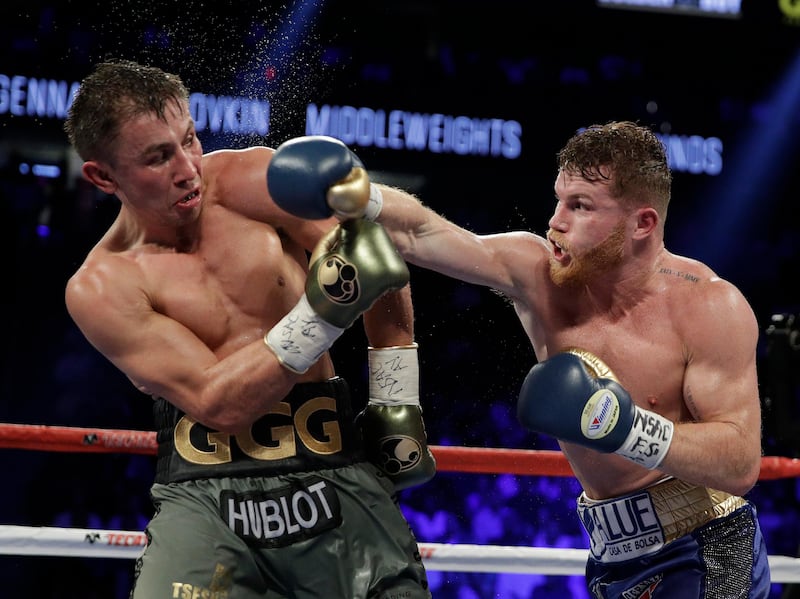 Canelo Alvarez, right, fights Gennady Golovkin during a middleweight title fight Saturday, Sept. 16, 2017, in Las Vegas. (AP Photo/John Locher)