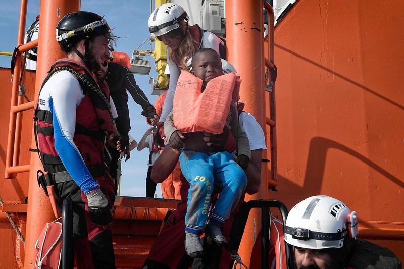 A rescued  child is transferred to the MV Aquarius rescue boat off Libyan coast. The 74 migrants of various nationalities, including women and children were rescued by  MV Aquarius, a rescue vessel chartered by SOS-Mediterranee and Doctors Without Borders. Louisa Gouliamaki / AFP