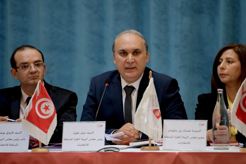 Tunisian President of the Independent High Authority for Elections (ISIE) Nabil Baffoun, centre, gives a press conference to release the dates of the legislative and presidential 2019 elections in Tunis.  AFP