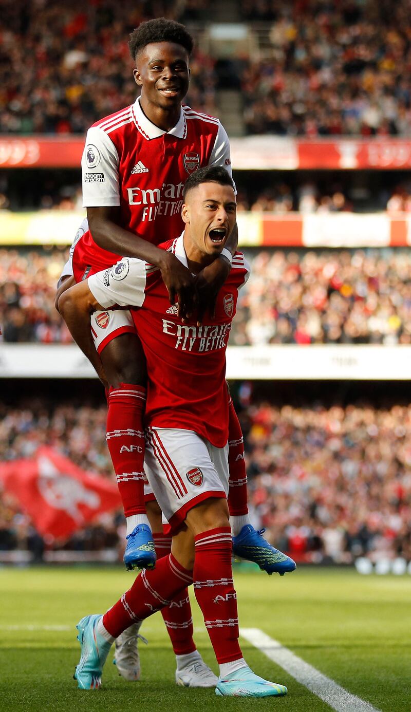 Gabriel Martinelli celebrates scoring with Bukayo Saka. AFP