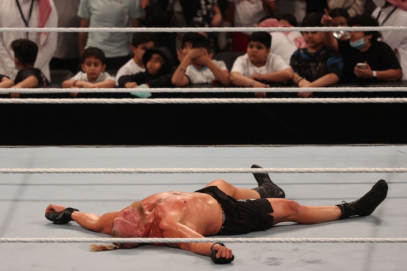 Brock Lesnar lies in the ring after his defeat.