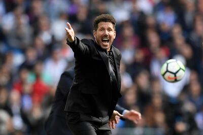 Atletico Madrid's Argentinian coach Diego Simeone reacts during the Spanish league football match between Real Madrid CF and Club Atletico de Madrid at the Santiago Bernabeu stadium in Madrid on April 8, 2018. / AFP PHOTO / GABRIEL BOUYS