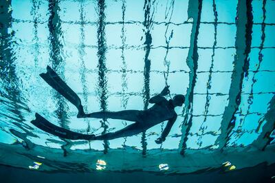 A diver is seen in the deepest pool in the world with 45.5-metre (150-foot) located in Mszczonow about 50 km from Warsaw, November 21, 2020.  The complex, named Deepspot, even includes a small wreck for scuba and free divers to explore. It has 8,000 cubic metres of water -- more than 20 times the amount in an ordinary 25-metre pool.
 / AFP / Wojtek RADWANSKI / TO GO WITH AFP STORY 
