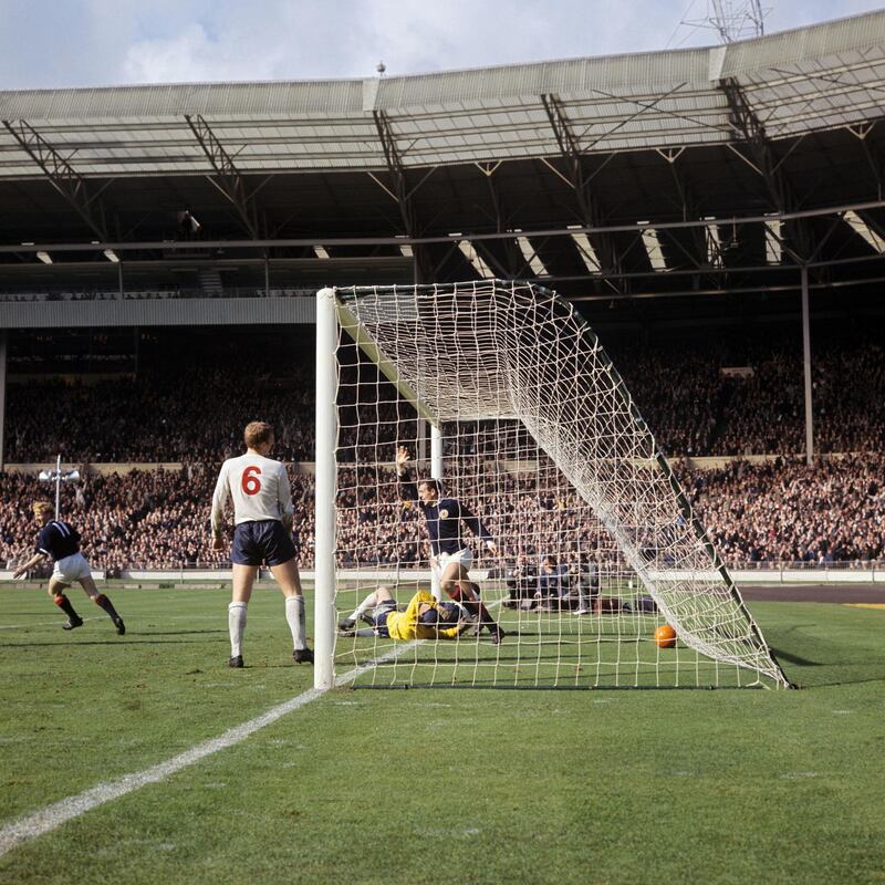 Scotland's Ian St John celebrates scoring against England during the 2-2 draw at Wembley in 1965. PA