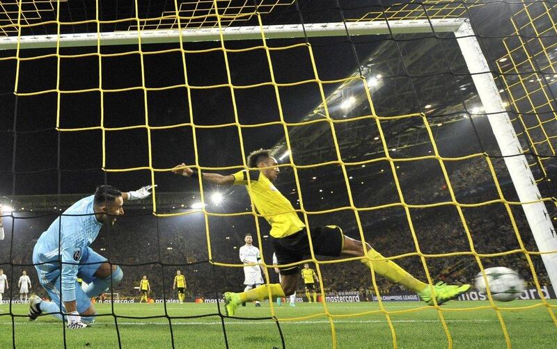 Borussia Dortmund’s Pierre-Emerick Aubameyang, right, scores his side’s opening goal past Real Madrid’s goalkeeper Keylor Navas. Martin Meissner / AP Photo
