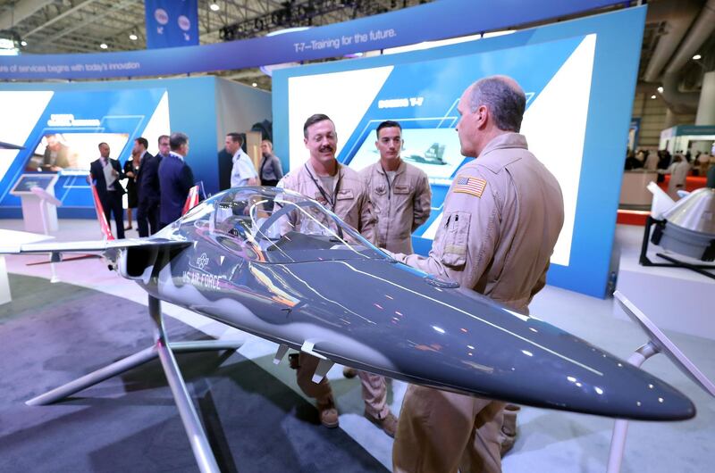 Dubai, United Arab Emirates - November 20, 2019: People gather round a model of a T-7A Red Hawk at Dubai airshow. Wednesday, November 20th, 2017 at Dubai Airshow, Dubai. Chris Whiteoak / The National