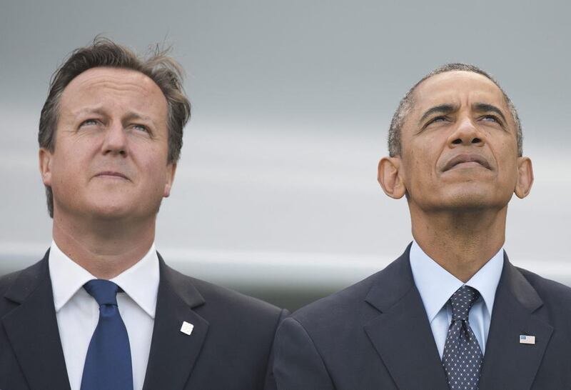 The British prime minister David Cameron and US president Barack Obama watch a NATO flypast in 2014. EPA