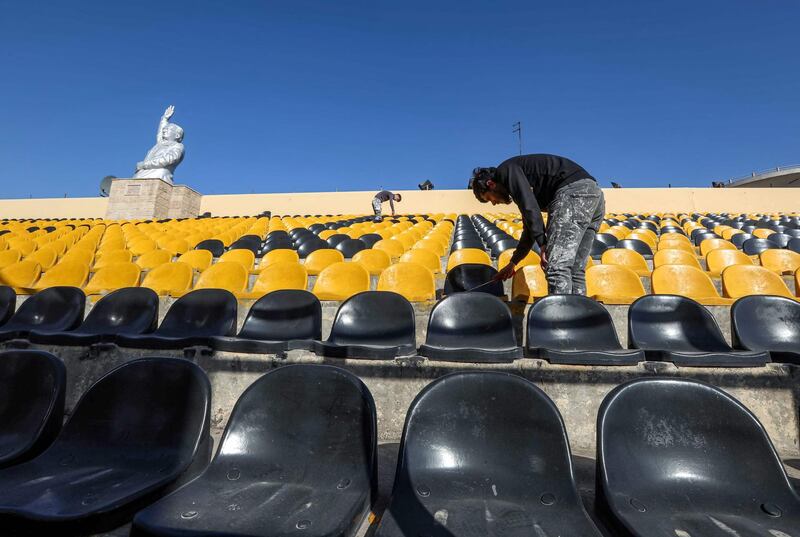 Workers prepare Franso Hariri Stadium in Erbil for the arrival of Pope Francis.  AFP