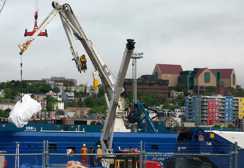 Debris from the Titan submersible, recovered from the ocean floor near the wreck of the Titanic, is unloaded from a ship in St John's, Newfoundland. All photos: AP