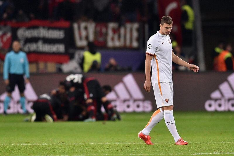 Edin Dzeko of AS Roma reacts after Bayer Leverkusen's equaliser in their Champions League contest on Tuesday night. Dennis Grombkowski / Bongarts / Getty Images / October 20, 2015 