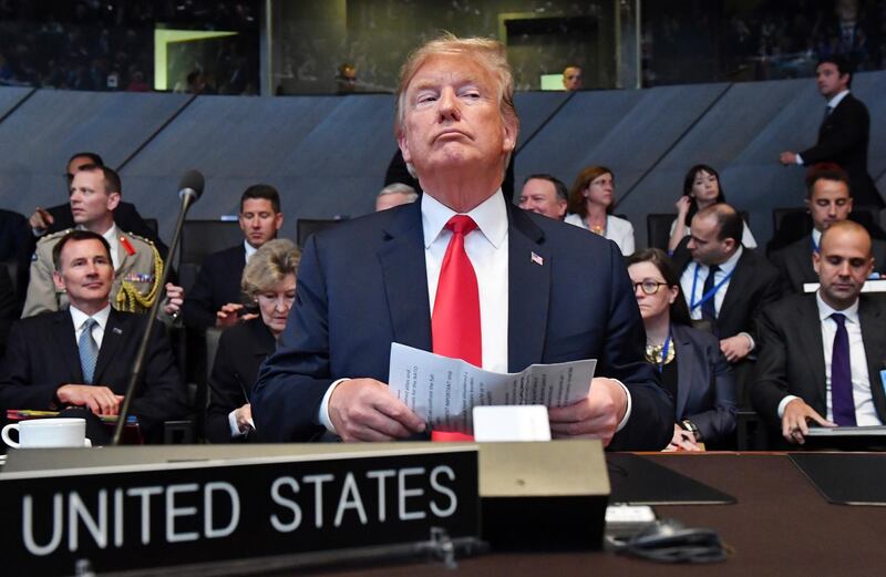 FILE - In this Wednesday, July 11, 2018 file photo U.S. President Donald Trump attends a meeting of the North Atlantic Council during a summit of heads of state and government at NATO headquarters in Brussels. NATO leaders gather in Brussels for a two-day summit to discuss Russia, Iraq and their mission in Afghanistan. (AP Photo/Geert Vanden Wijngaert, File)