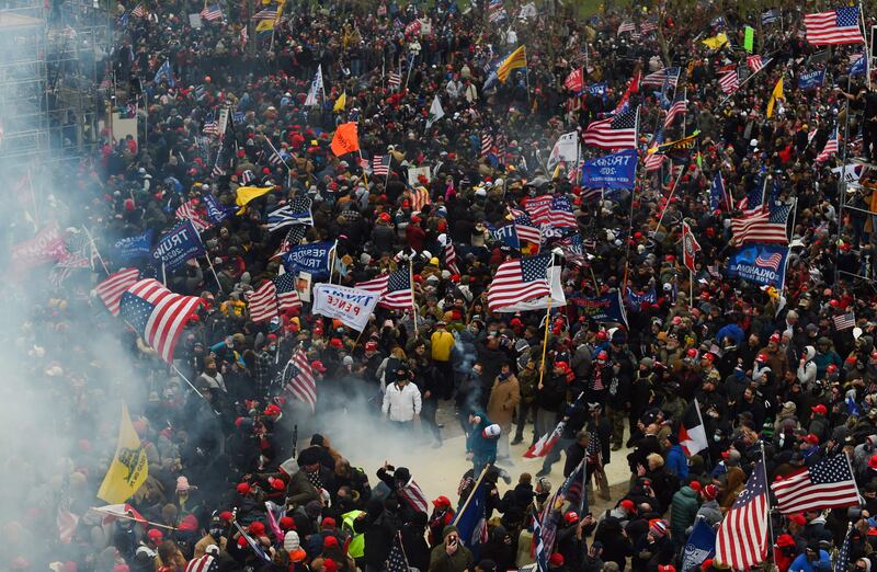 This photo taken on January 6, 2021, shows Trump supporters battling with police and security forces as they storm the US Capitol building in Washington. AFP