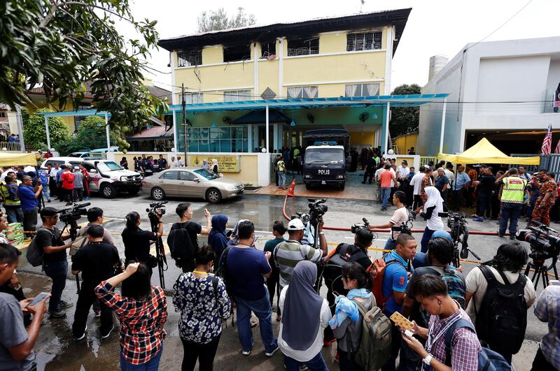 Media crowd outside religious school Darul Quran Ittifaqiyah after a fire broke out in Kuala Lumpur, Malaysia. Lai Seng Sin / Reuters