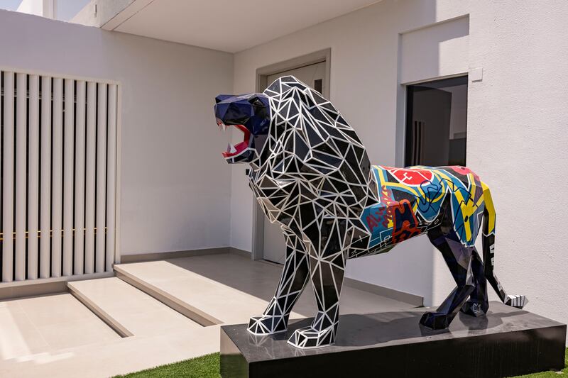 A custom-made lion sculpture sits at the main entrance