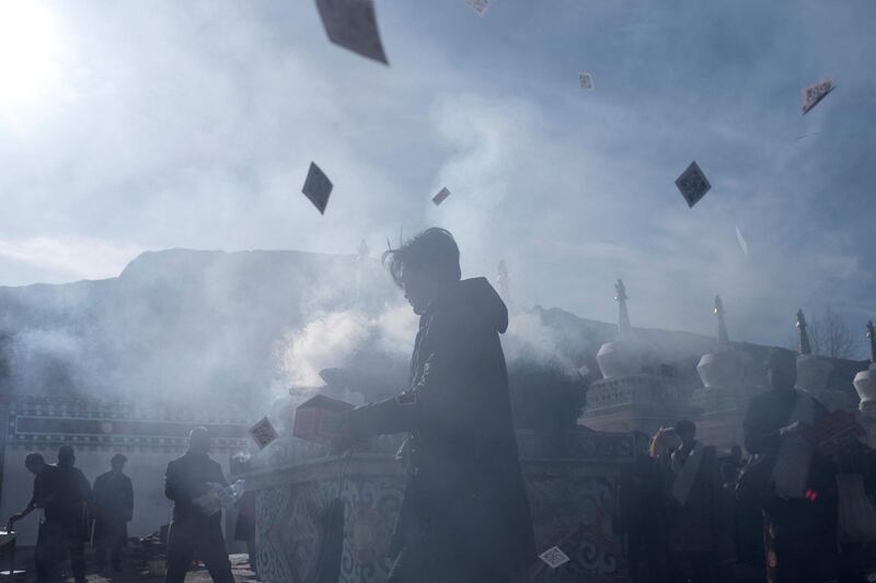 Villagers burning incense near a temple during Tibetan New Year celebrations in the village of Douhoulou, about 50km south of Guide on the Qinghai-Tibet Plateau. Johannes Eisele / AFP Photo