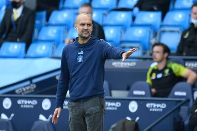 Manchester City's head coach Pep Guardiola gestures during the English Premier League soccer match between Manchester City and Norwich City at the Etihad Stadium in Manchester, England, Sunday, July 26, 2020. (Peter Powelll/Pool via AP)