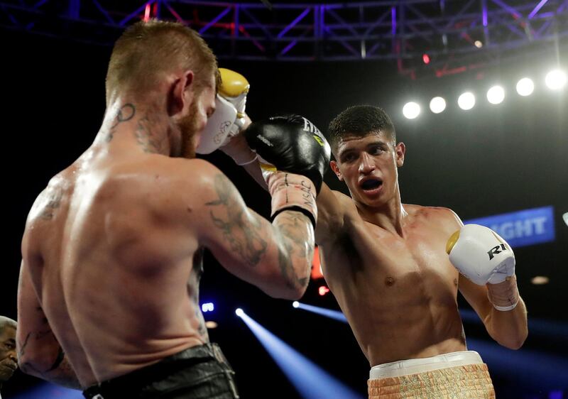 Sebastian Fundora, right, punches Daniel Lewis, of Australia, during their super welterweight boxing match in Las Vegas.  AP