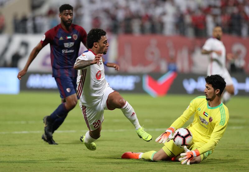 Sharjah, United Arab Emirates - May 15, 2019: Football. Sharjah's Ryan Mendes cant beat the keeper during the game between Sharjah and Al Wahda in the Arabian Gulf League. Wednesday the 15th of May 2019. Sharjah Football club, Sharjah. Chris Whiteoak / The National