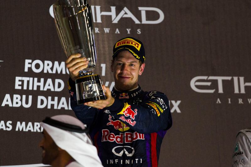 Abu Dhabi, United Arab Emirates, November 3, 2013:       Sebastian Vettel of Red Bull celebrates driving to victory during the Formula One Etihad Airways Abu Dhabi Grand Prix Yas Marina Circuit in Abu Dhabi on November 3, 2013. Christopher Pike / The National

Reporter: N/A
Section: News *** Local Caption ***  CP1103-f1_016.JPG