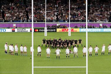 England players watch the All Blacks perform their haka during the Rugby World Cup semifinal at International Yokohama Stadium between New Zealand and England in Yokohama, Japan, Saturday, Oct. 26, 2019. (Kyodo News via AP)