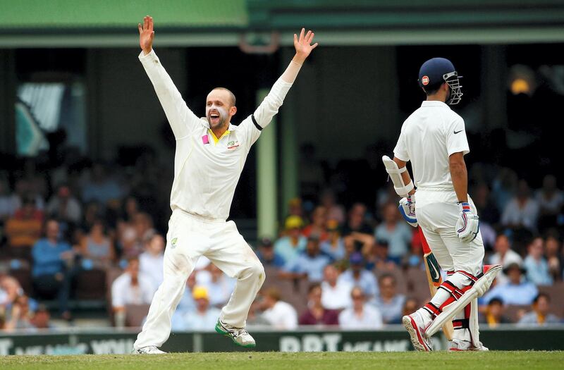 SYDNEY, AUSTRALIA - JANUARY 10:  Nathan Lyon of Australia celebrates after taking the wicket of Wriddhiman Saha of India during day five of the Fourth Test match between Australia and India at Sydney Cricket Ground on January 10, 2015 in Sydney, Australia.  (Photo by Daniel Munoz/Getty Images)