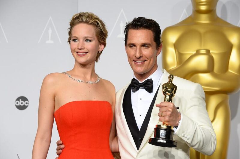 Matthew McConaughey, right, winner of the award for best actor for his role in the Dallas Buyers Club poses with Jennifer Lawrence. AP 