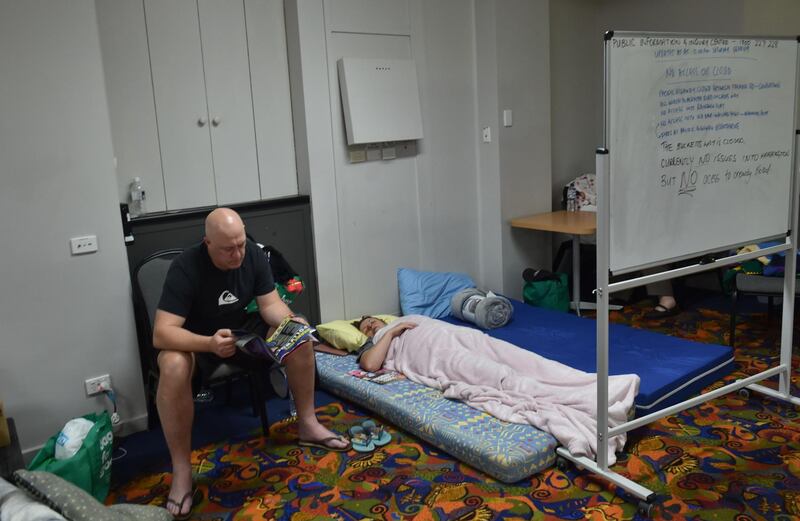 Residents take refuge at a local club in Taree, 350km north of Sydney, as firefighters try to contain dozens of out-of-control blazes that are raging in the state of New South Wales. AFP