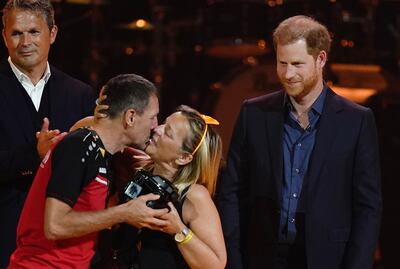 The Duke of Sussex presents an award to a Team Belgium player. PA