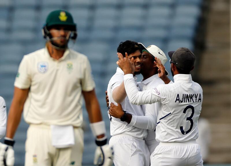 India bowler Umesh Yadav, without cap, celebrates after dismissing South Africa's Aiden Markram. AP