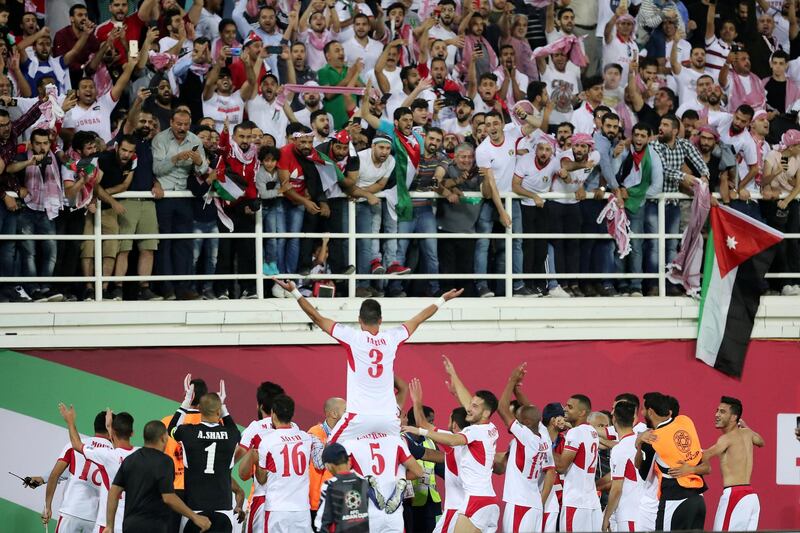 AL AIN , UNITED ARAB EMIRATES , January 10 – 2019 :- Players of Jordan celebrating with fans after won the match against Syria by 2-0 in the AFC Asian Cup UAE 2019 football match between Jordan vs Syria held at Sheikh Khalifa International Stadium in Al Ain. ( Pawan Singh / The National ) For News/Sports/Instagram