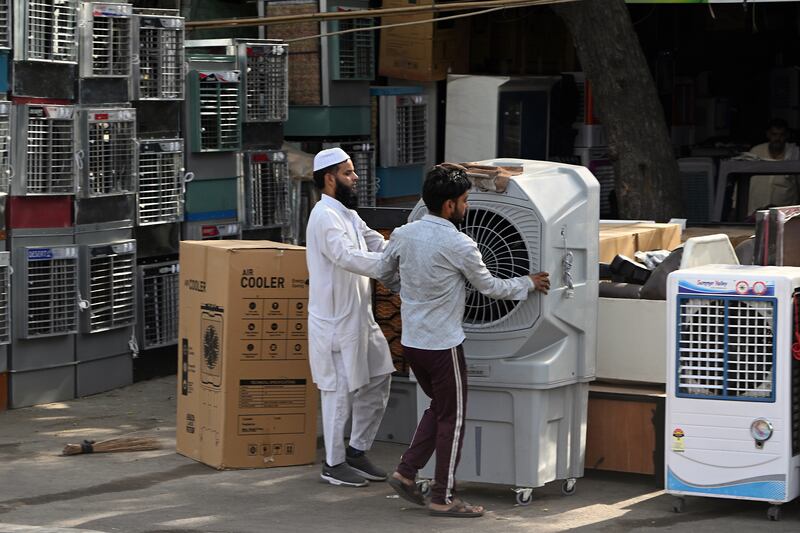 Air coolers for sale in New Delhi. Record demand for water and electricity has created shortages in parts of the city. Bloomberg