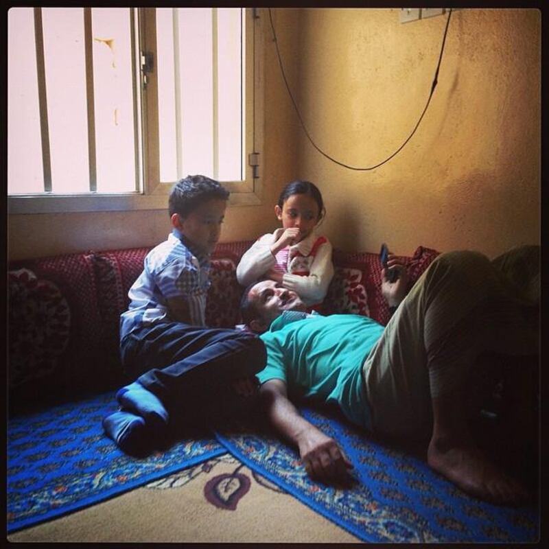 A man plays with his children after a weekend lunch in Sana'a, Yemen. Photo by Alex Kay Potter (@alexkpotter), March 2014.