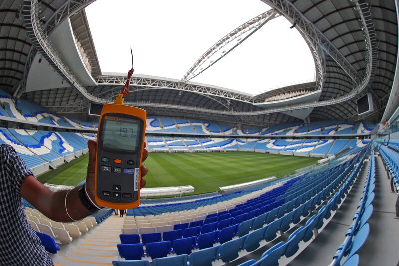 A digital thermometer measures the temperature at the Al Janoub Stadium in Doha.