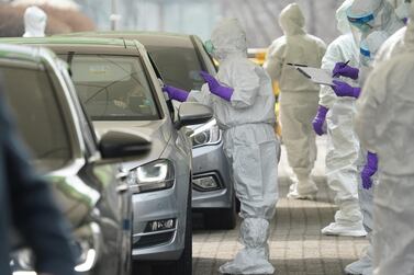 A driver gets a coronavirus test at a drive-through clinic in Seoul, South Korea on March 3, 2020. Reuters