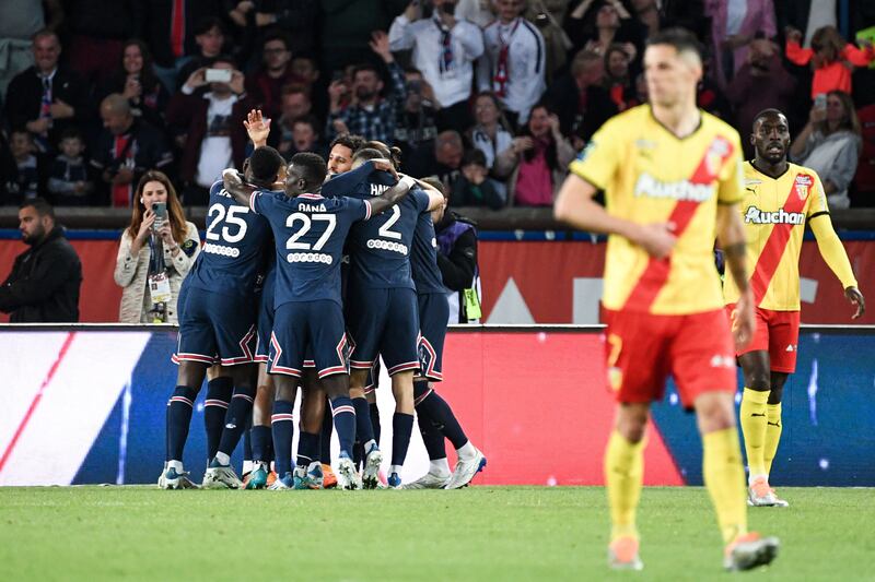 PSG players celebrate after Lionel Messi opened the scoring against Lens. AFP