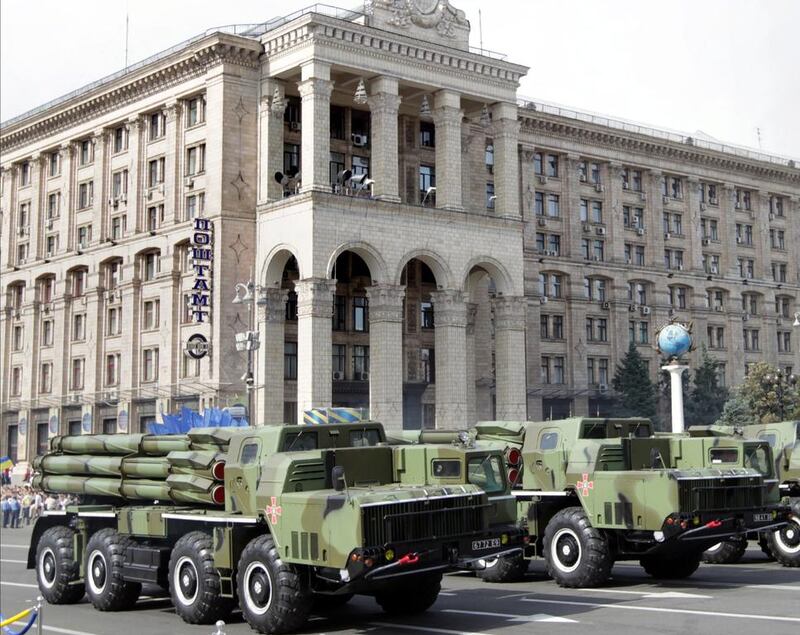 ‘Smerch’ multiple rocket launcher systems drive past the main post office building at Kiev’s Independence Square. Tatyana Zenkovich/EPA