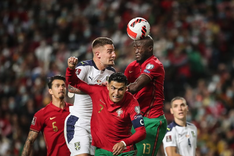 Portugal's Cristiano Ronaldo and Danilo in action against Serbia's Milinkovic-Savic. EPA
