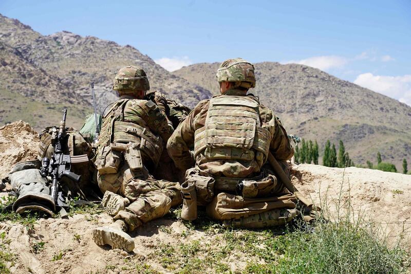 (FILES) In this file photo taken on June 6, 2019, US soldiers look out over hillsides during a visit of the commander of US and NATO forces in Afghanistan General Scott Miller at the Afghan National Army (ANA) checkpoint in Nerkh district of Wardak province. Senior US officials insisted that progress was being made in Afghanistan despite clear evidence the war there had become unwinnable, The Washington Post reported on December 9, 2019 after obtaining thousands of US government documents on the conflict. The Post said it had collected more than 2,000 pages of notes of interviews with top US military officers and diplomats, aid workers, Afghan officials and others who played a direct role in the nearly two-decade-old war.
 - 
 / AFP / THOMAS WATKINS
