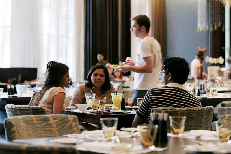 DUBAI, UNITED ARAB EMIRATES - February 27, 2009: (left) Romita Maitra, (center) Kalpana Pratap, and (right) Pradyut Pratap dine at the Friday brunch hosted by Fazaris restaurnat in the Address Hotel in Dubai. ( Ryan Carter / The National )

*** for restaurant review by James Brennan *** Local Caption ***  RC017-Fazaris.jpgRC017-Fazaris.jpg