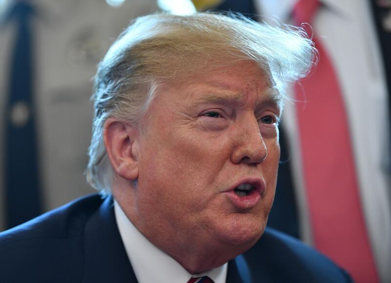 (FILES) In this file photo taken on March 15, 2019 US President Donald Trump speaks on border security from the Oval Office of the White House in Washington, DC.  President Donald Trump on March 18, 2019 complained that he is being blamed by journalists for the massacre of 50 people in attacks on two mosques in New Zealand."The Fake News Media is working overtime to blame me for the horrible attack in New Zealand," Trump told his more than 59 million followers on Twitter."They will have to work very hard to prove that one," he tweeted. "So Ridiculous!"
 / AFP / Nicholas Kamm
