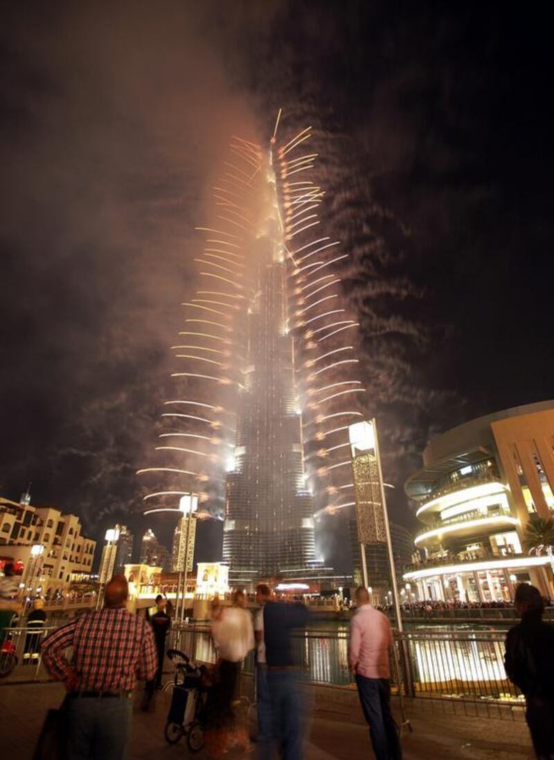 People celebrate to the fireworks display. Ali Haider/ EPA