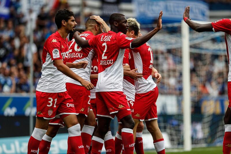 Monaco's team celebrate their first goal during the French League One soccer match between Strasbourg and Monaco in Strasbourg, eastern France in Strasbourg Eastern France (AP Photo/Jean-Francois Badias)