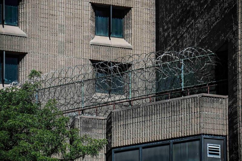 This photo from Saturday Aug. 10, 2019, shows razor wire fencing at the Metropolitan Correctional Center in New York where financier Jeffrey Epstein died while awaiting trial on sex-trafficking charges. (A P Photo/Bebeto Matthews)